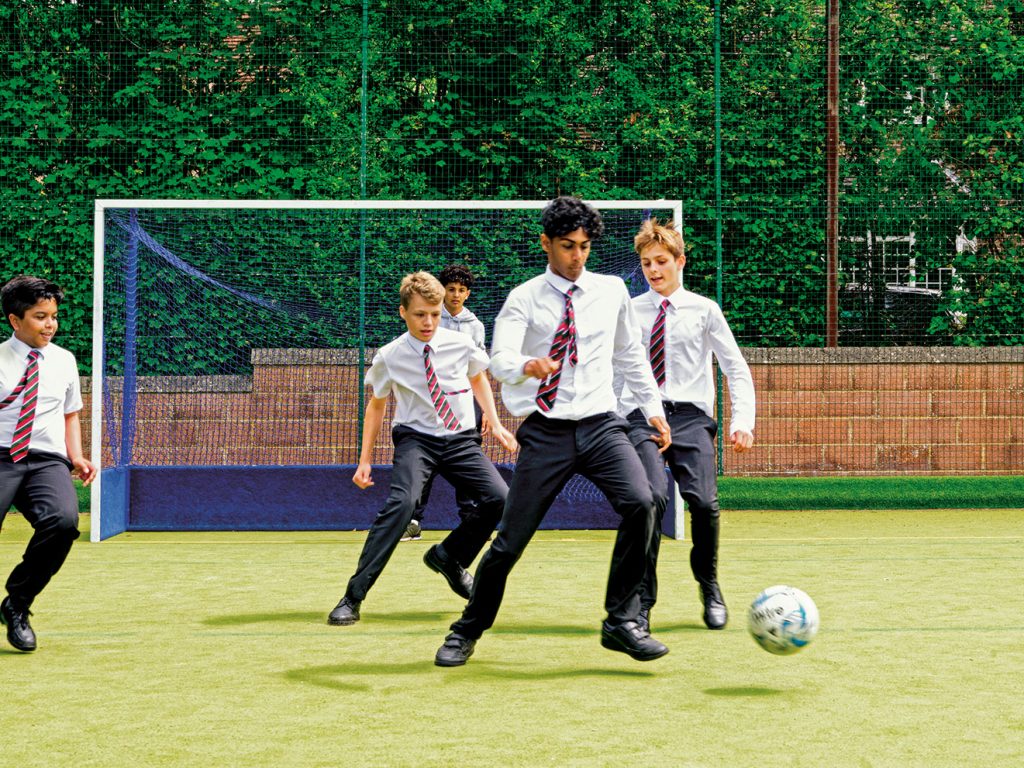 3 boys with a football