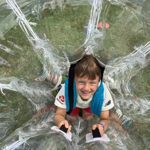 student in a zorbing ball