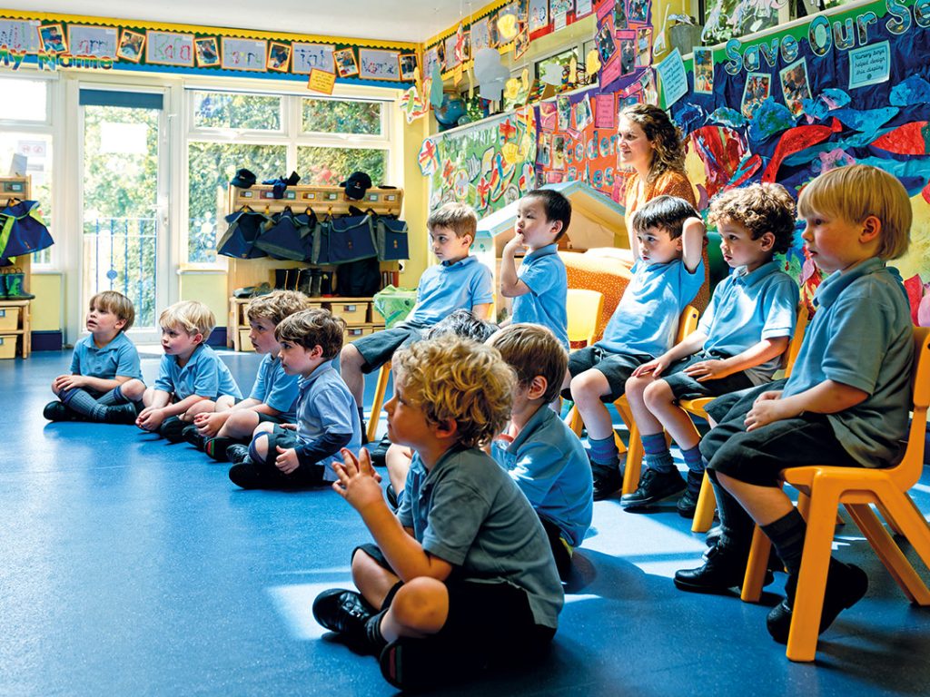 students sat in the nursery classroom