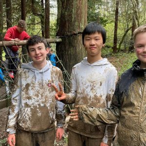 students covered in mud
